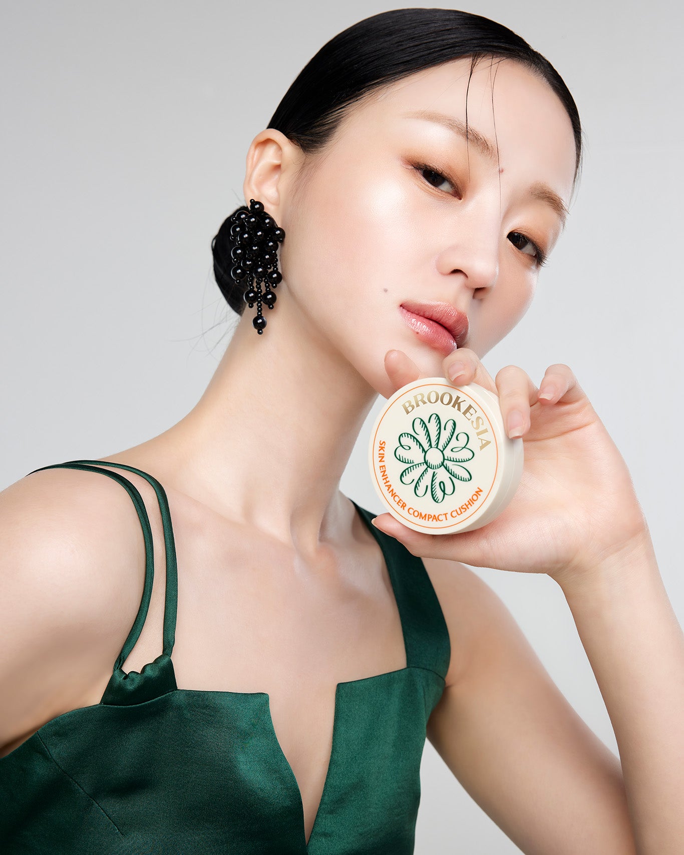 Model showcasing the Brookesia Skin Enhancer Compact Cushion