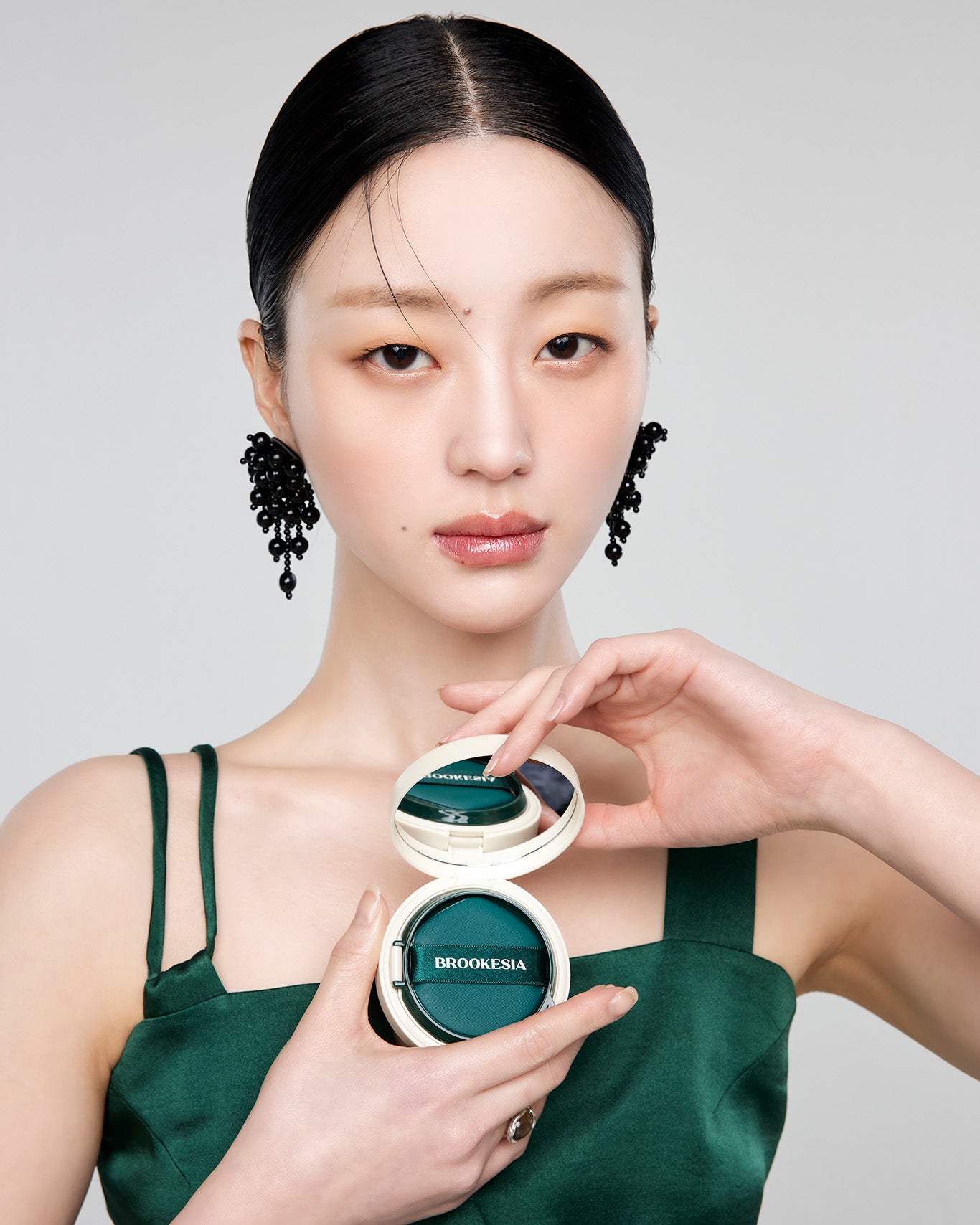 Model opens Brookesia Skin Enhancer Compact Cushion (Glow)